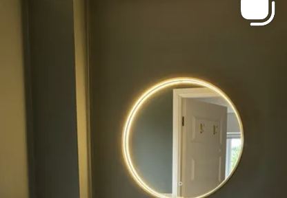 Bathroom with green feature wall and gold fittings