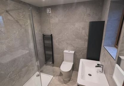 Modern grey bathroom installation by Stuart Barnes