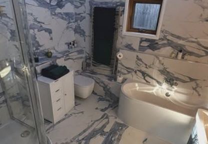 Marble effect bathroom with freestanding bath