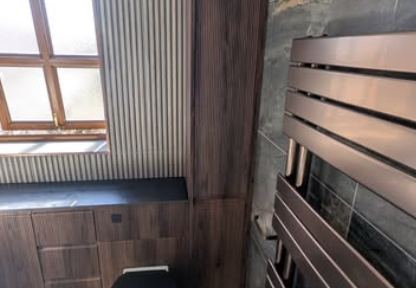 Bathroom with wood panel and slate tiling